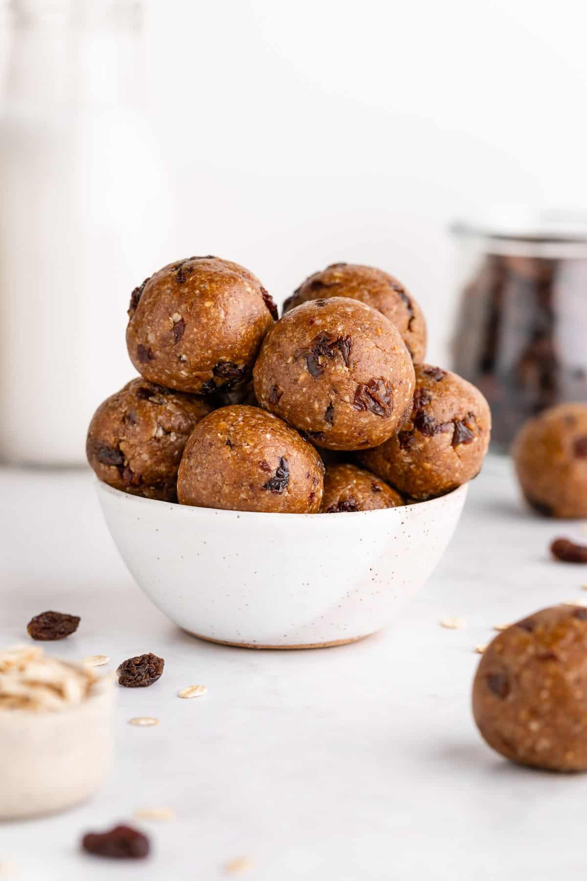 a small speckled bowl filled with oatmeal raisin energy bites