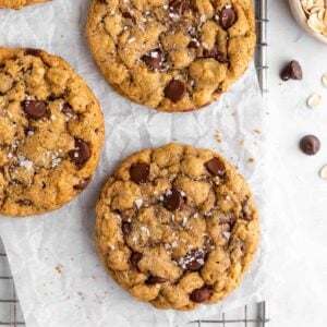 vegan oatmeal chocolate chip cookies on a wire cooling rack