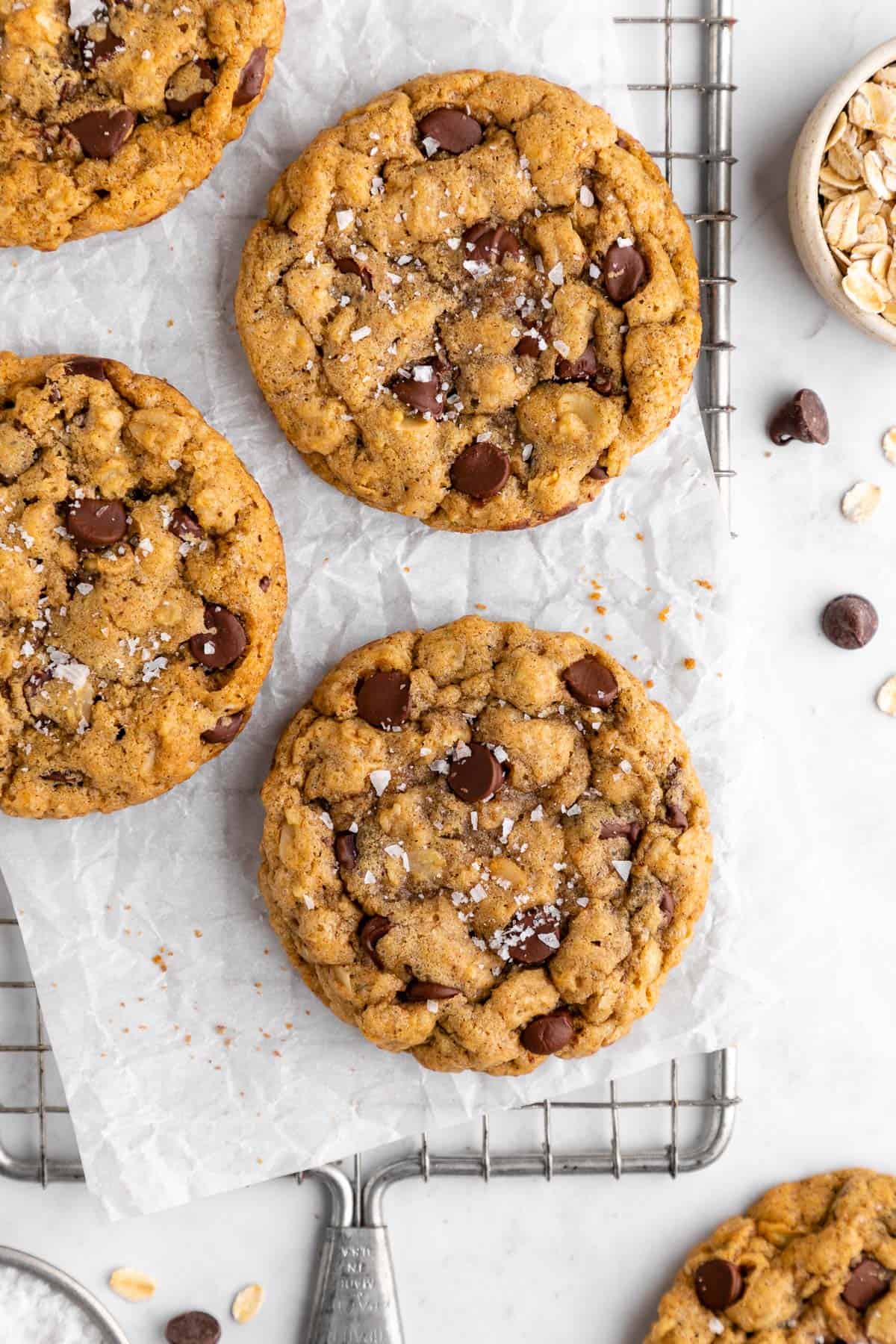 vegan oatmeal chocolate chip cookies on a wire cooling rack