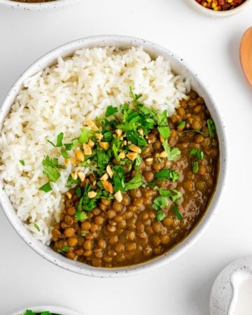 vegan slow cooker lentil curry with rice inside a bowl