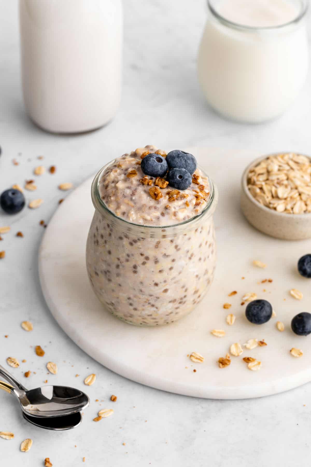 vegan basic overnight oats in a jar with blueberries on top
