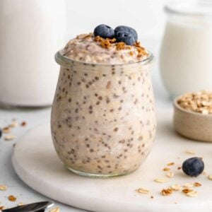 a jar of vegan basic overnight oats with chia seeds, yogurt, and almond milk