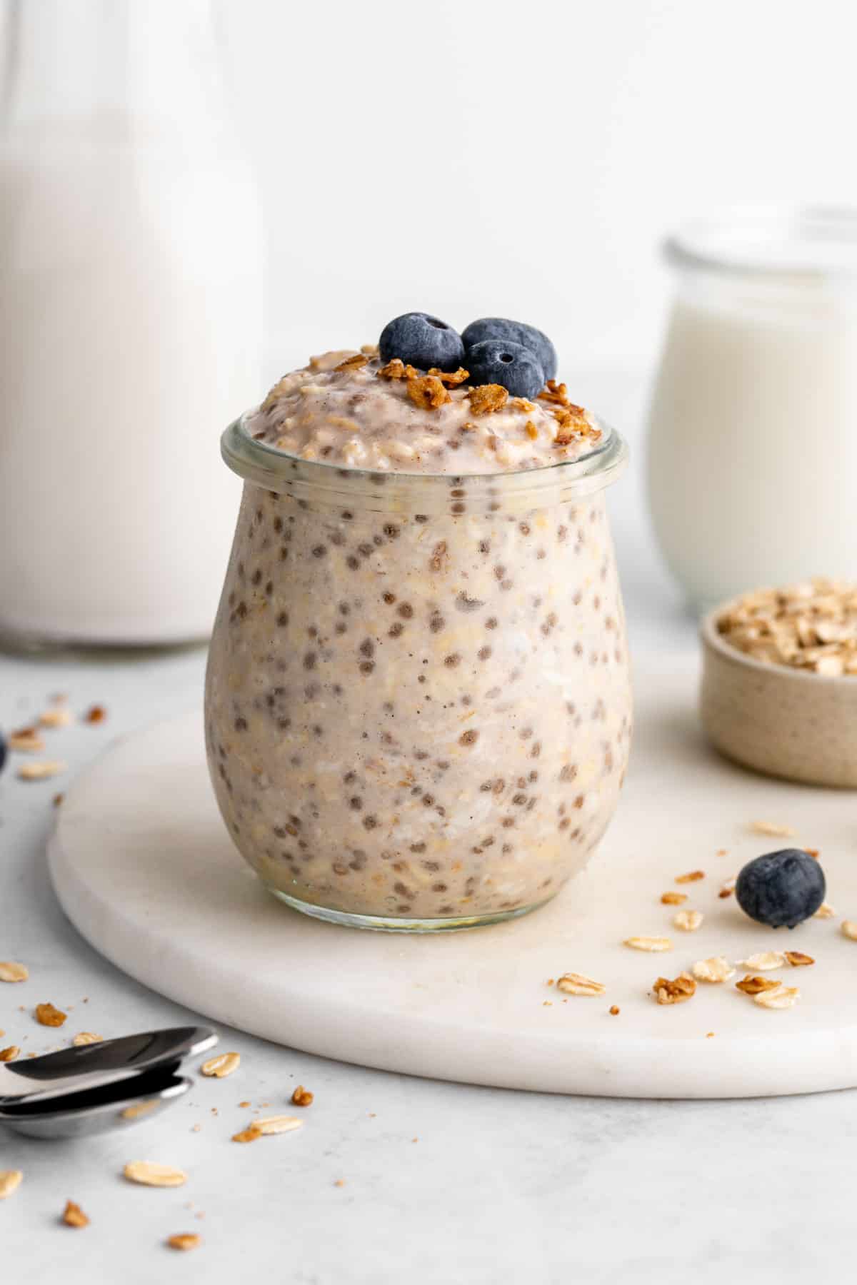 a jar of vegan basic overnight oats with chia seeds, yogurt, and almond milk