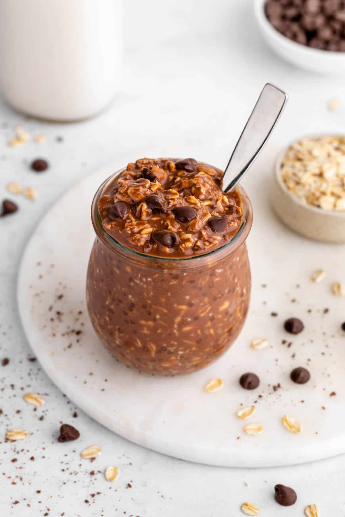 vegan chocolate overnight oats in a jar with chocolate chips