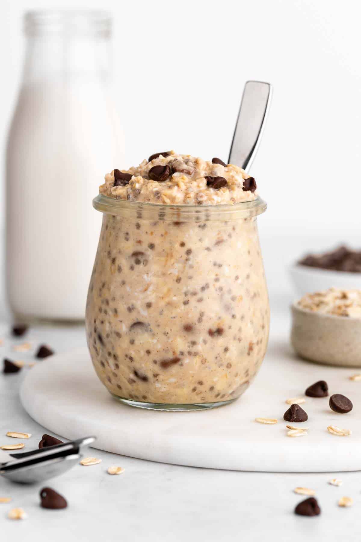 vegan chocolate chip cookie dough overnight oats in a jar with a spoon