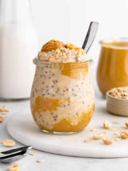 a jar of vegan peanut butter overnight oats with yogurt, chia seeds, and almond milk