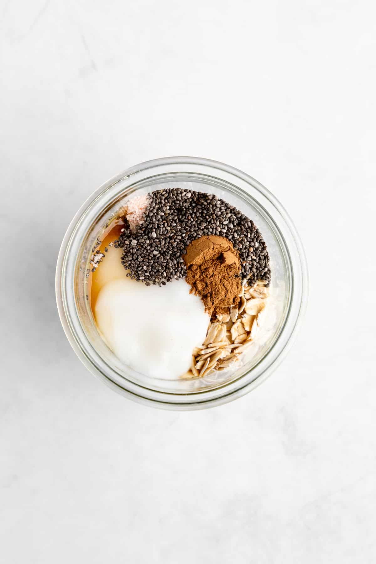 rolled oats, dairy-free yogurt, chia seeds, maple syrup, and vanilla in a mason jar