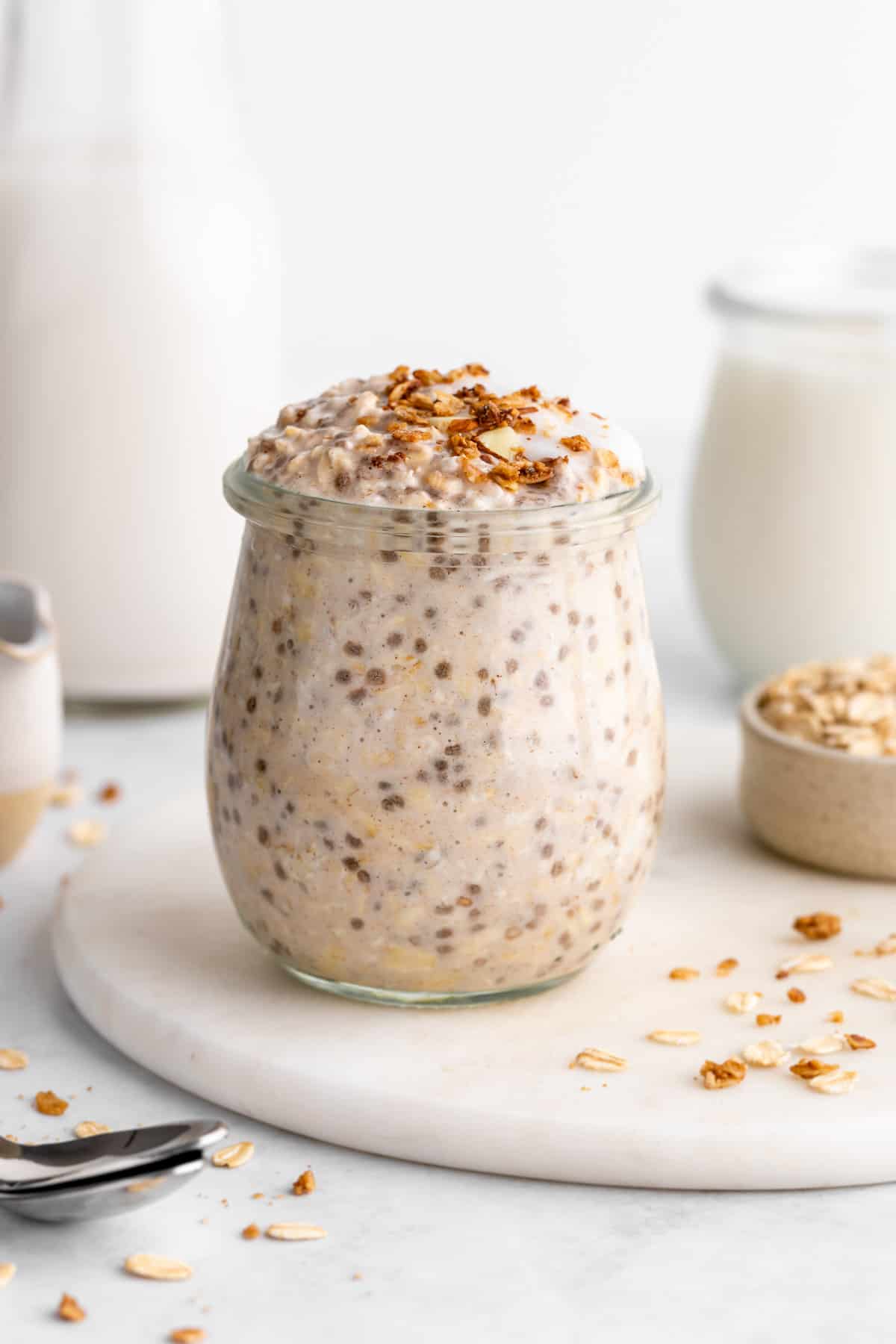 vegan vanilla overnight oats with dairy-free yogurt and chia seeds inside a jar