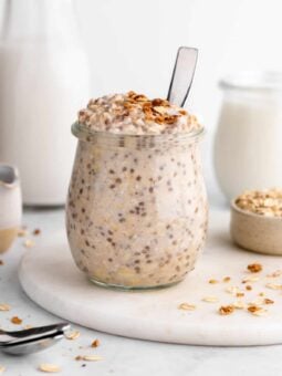 vegan vanilla overnight oats with yogurt and chia seeds inside a jar