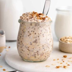 vegan vanilla overnight oats with yogurt and chia seeds inside a jar