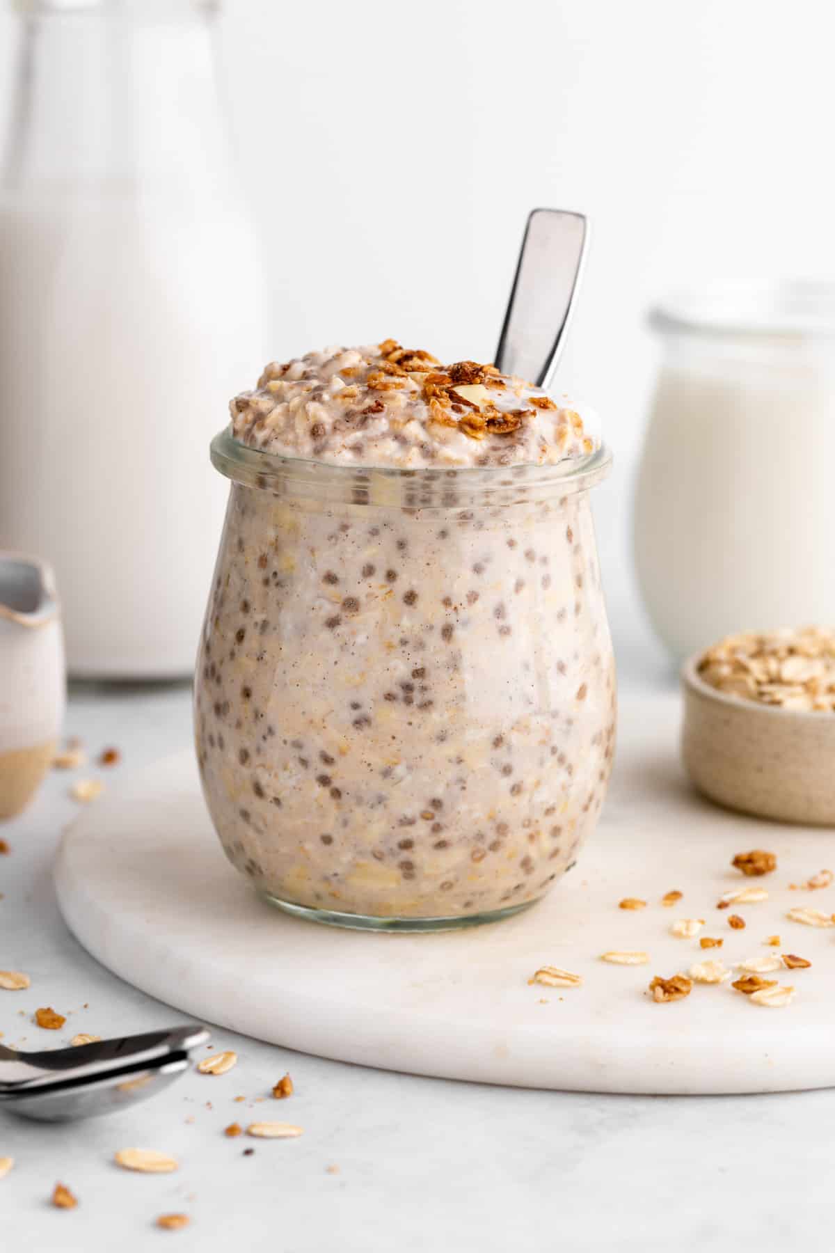 vegan vanilla overnight oats with yogurt and chia seeds inside a jar