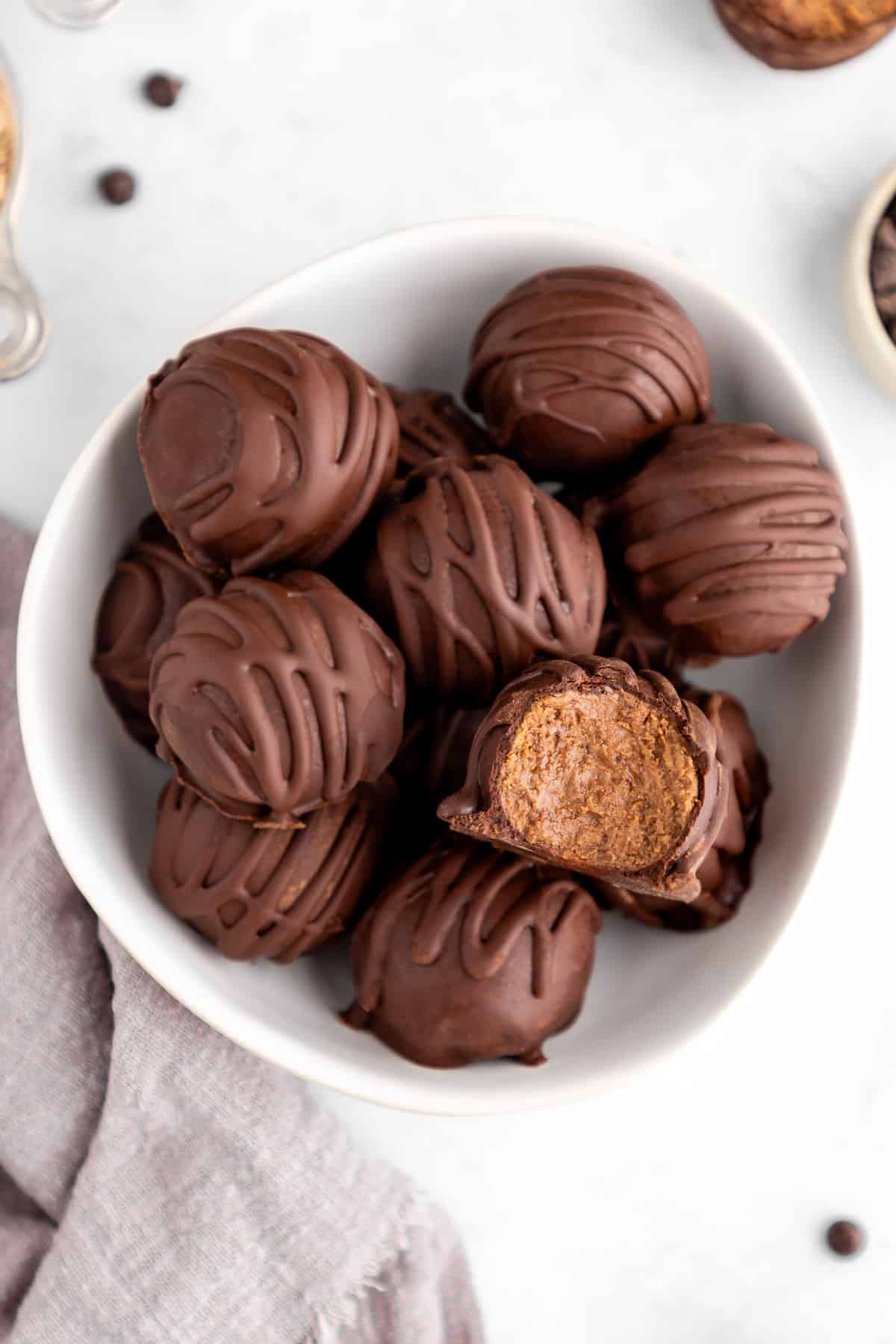 a bowl of chocolate protein truffles