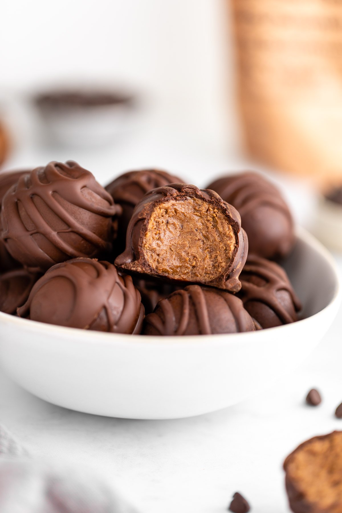 a bowl of chocolate protein truffles