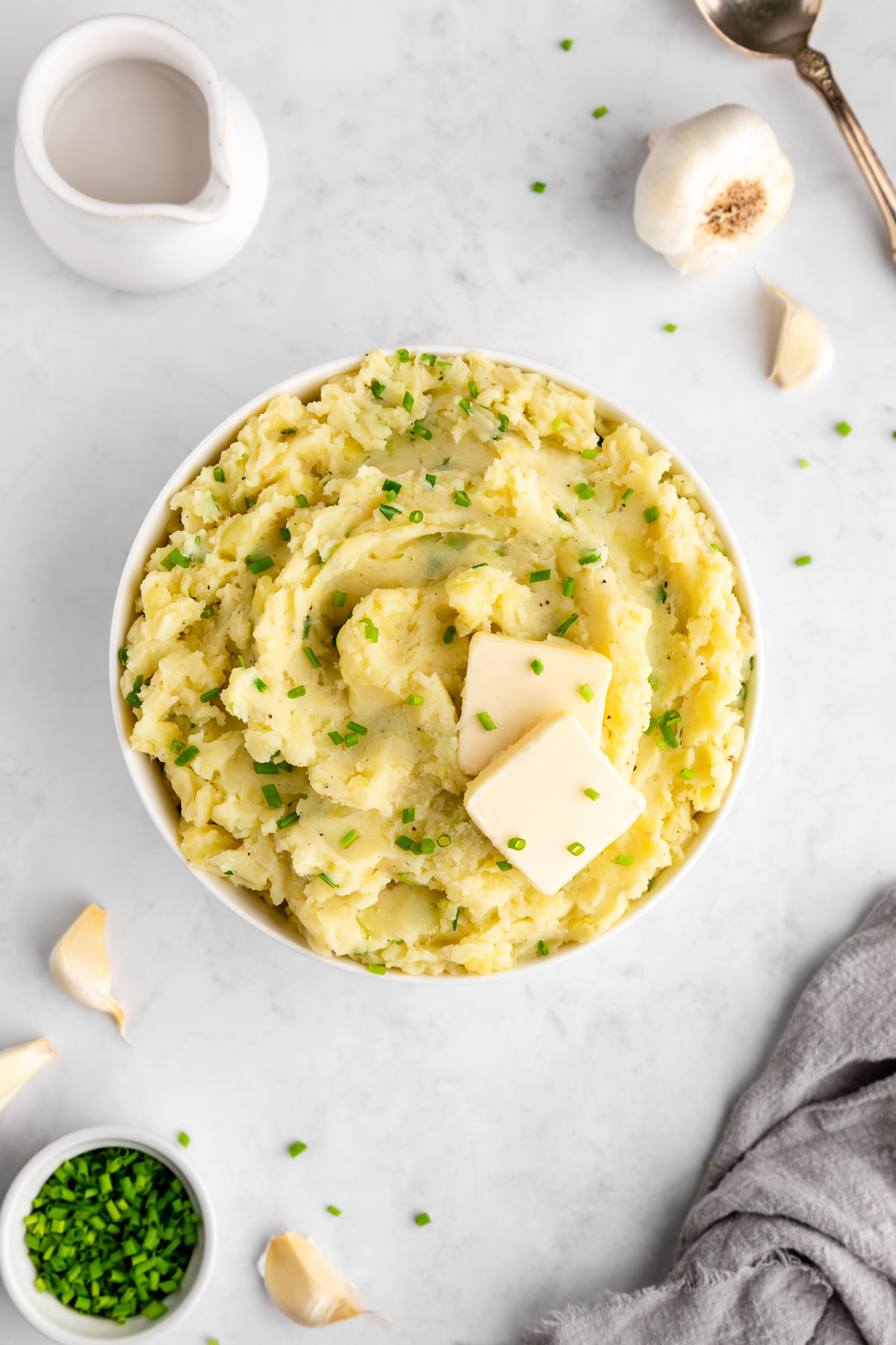 a bowl of vegan garlic chive mashed potatoes