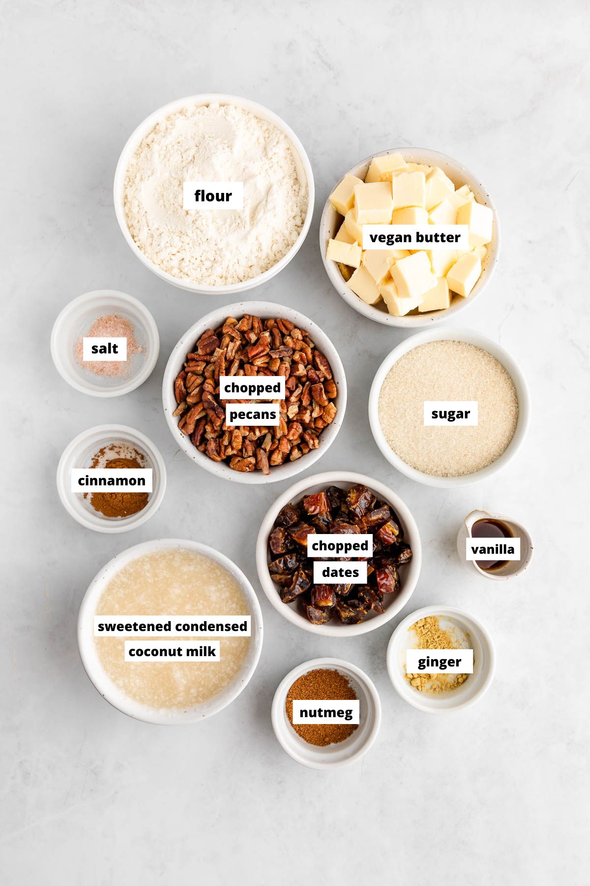 bowls of ingredients for vegan pecan pie bars