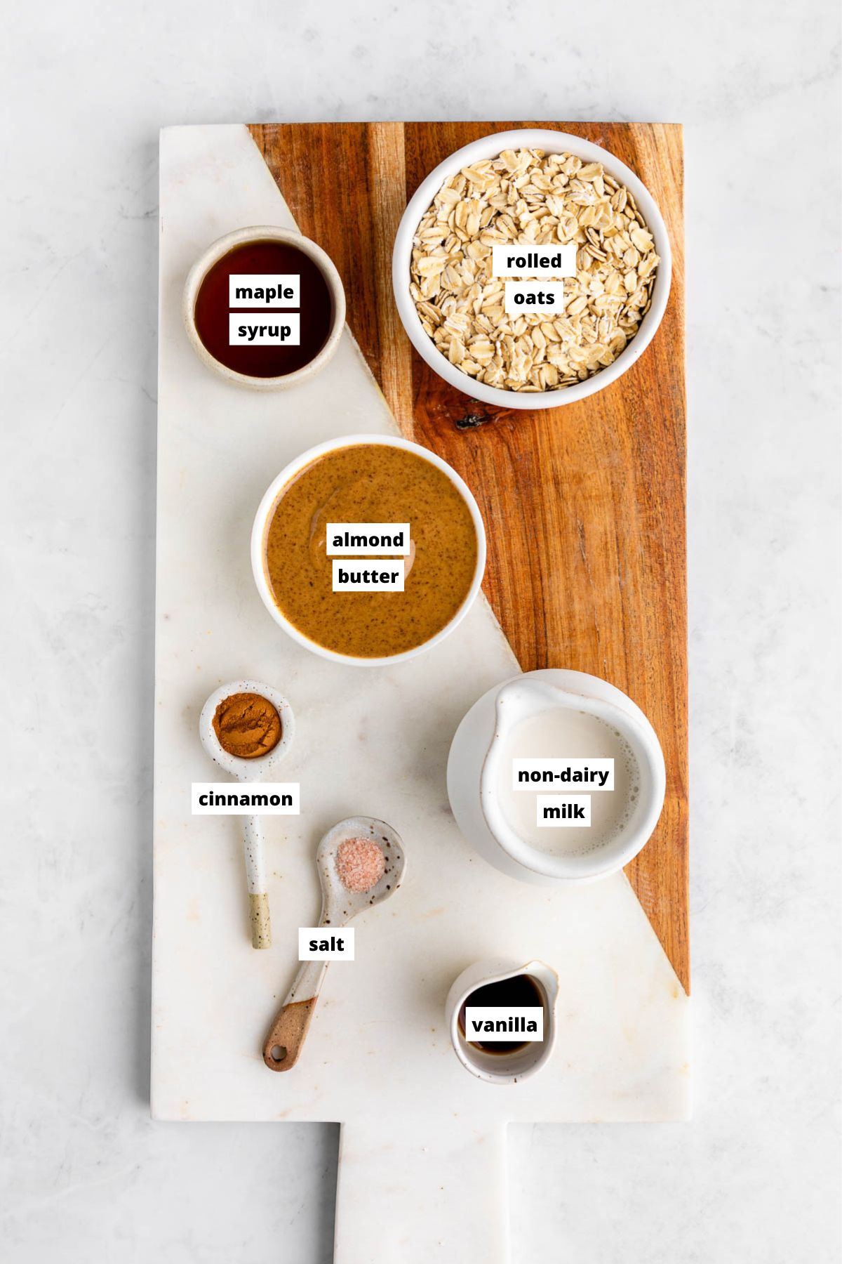 almond butter oatmeal ingredients on a marble serving board