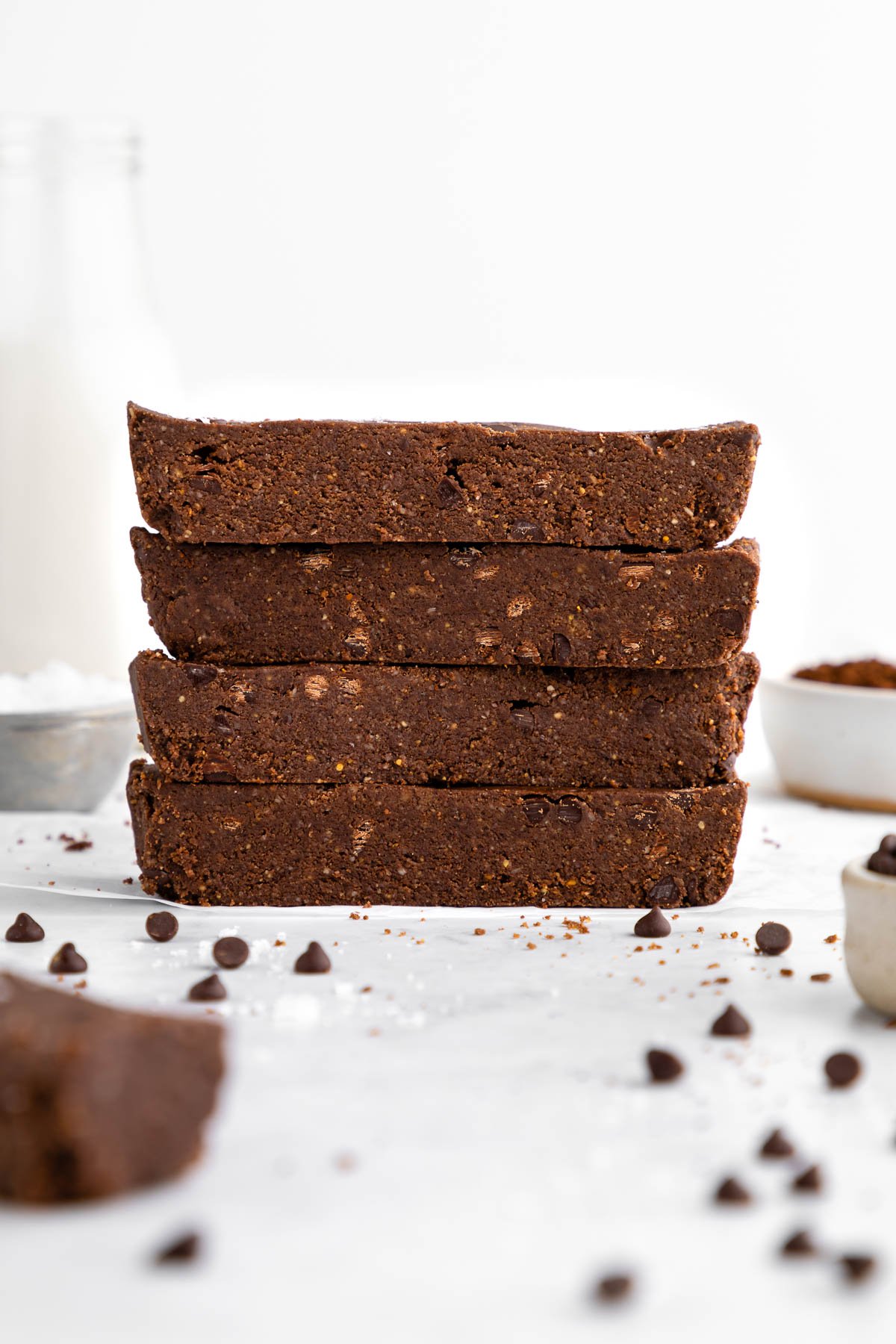 a stack of chocolate brownie protein bars