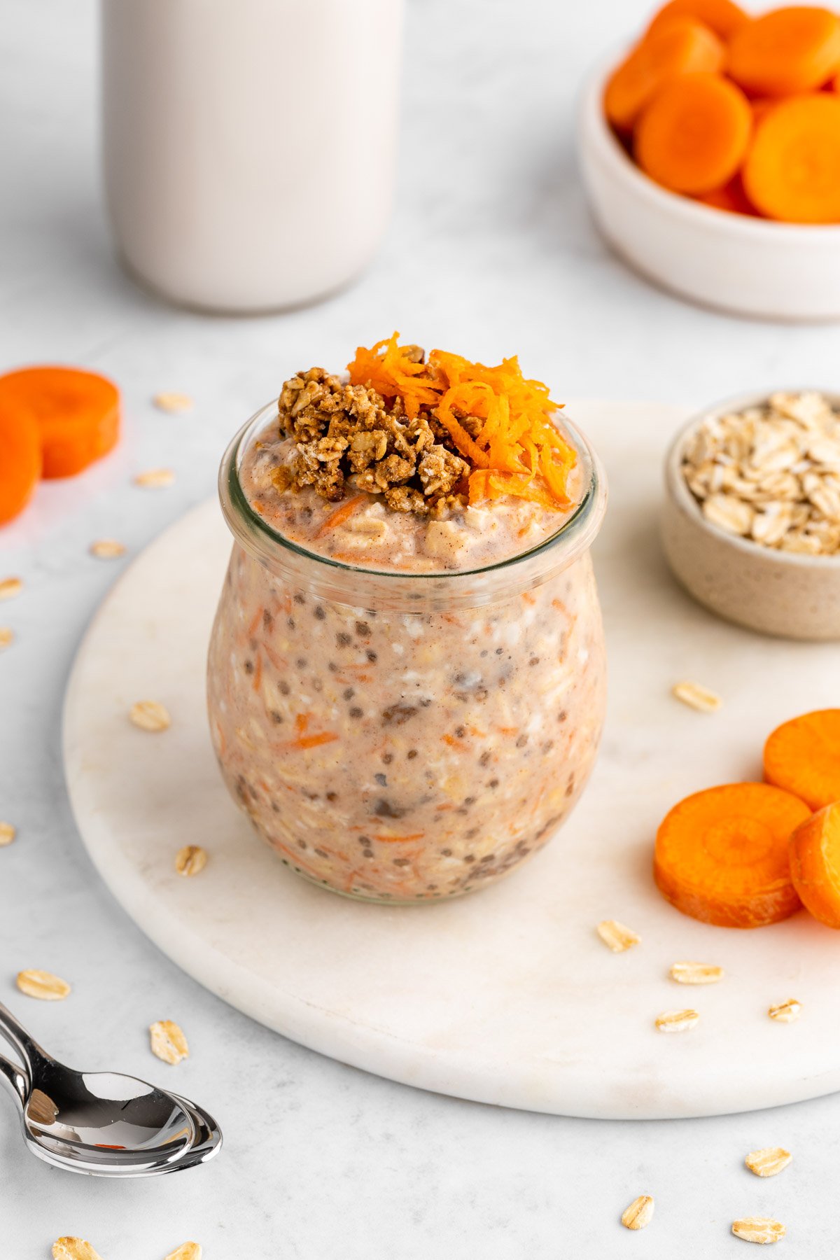 carrot cake overnight oats in a jar with chia seeds and yogurt