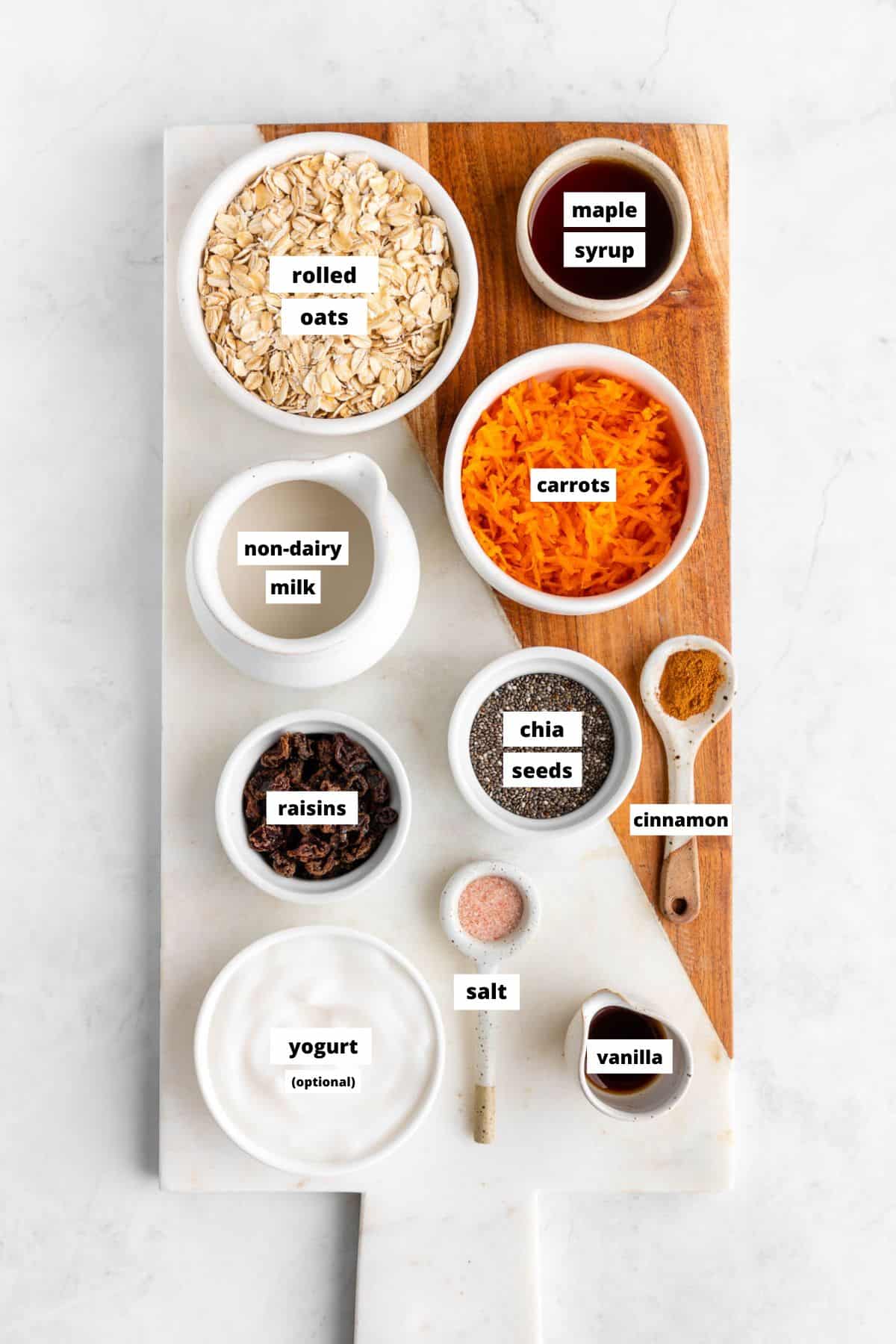 ingredients for carrot cake overnight oats on a marble serving board