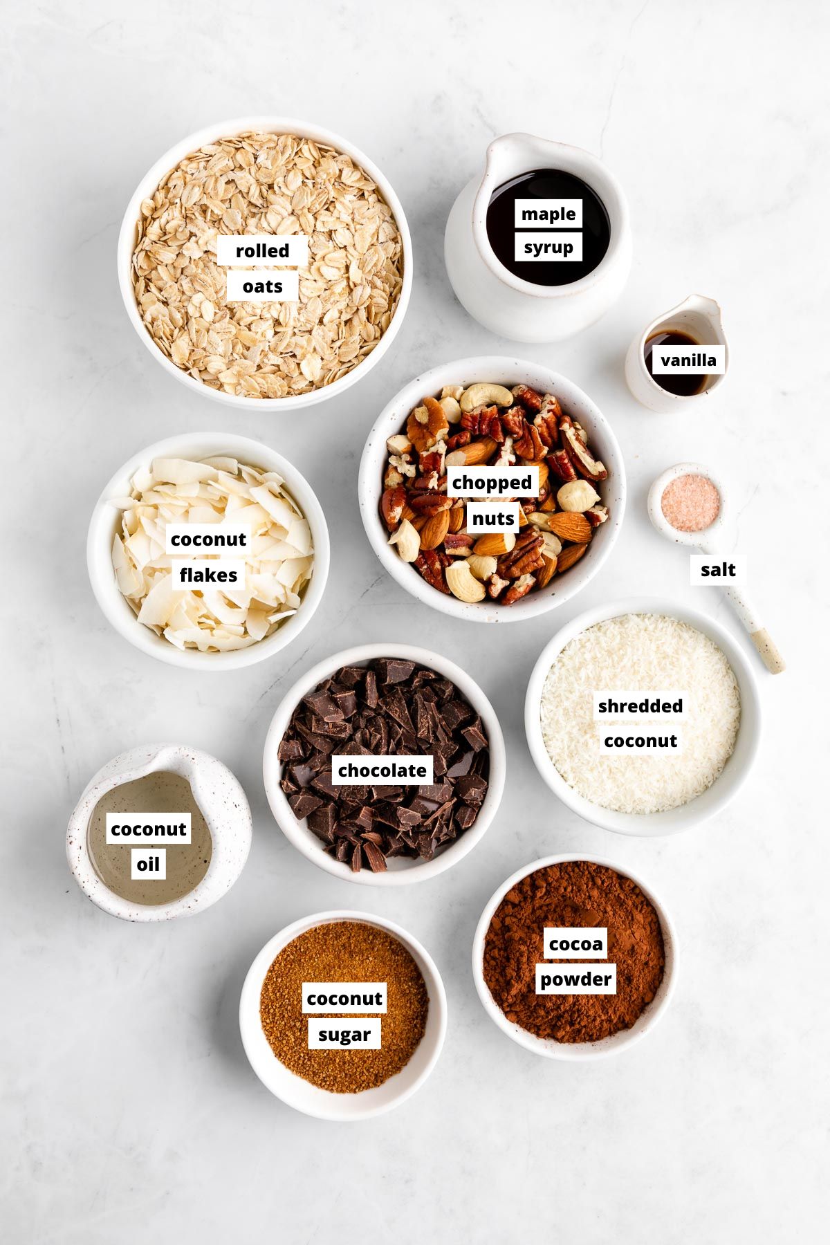 bowls of ingredients for homemade chocolate coconut granola