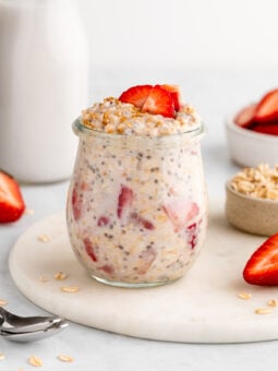 strawberries and cream overnight oats in a jar with yogurt