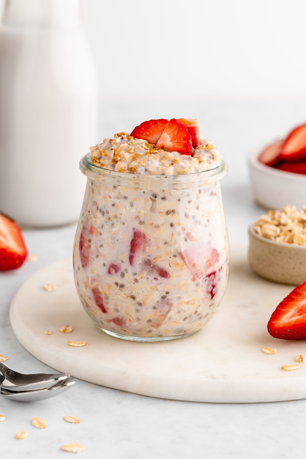 strawberries and cream overnight oats in a jar with yogurt