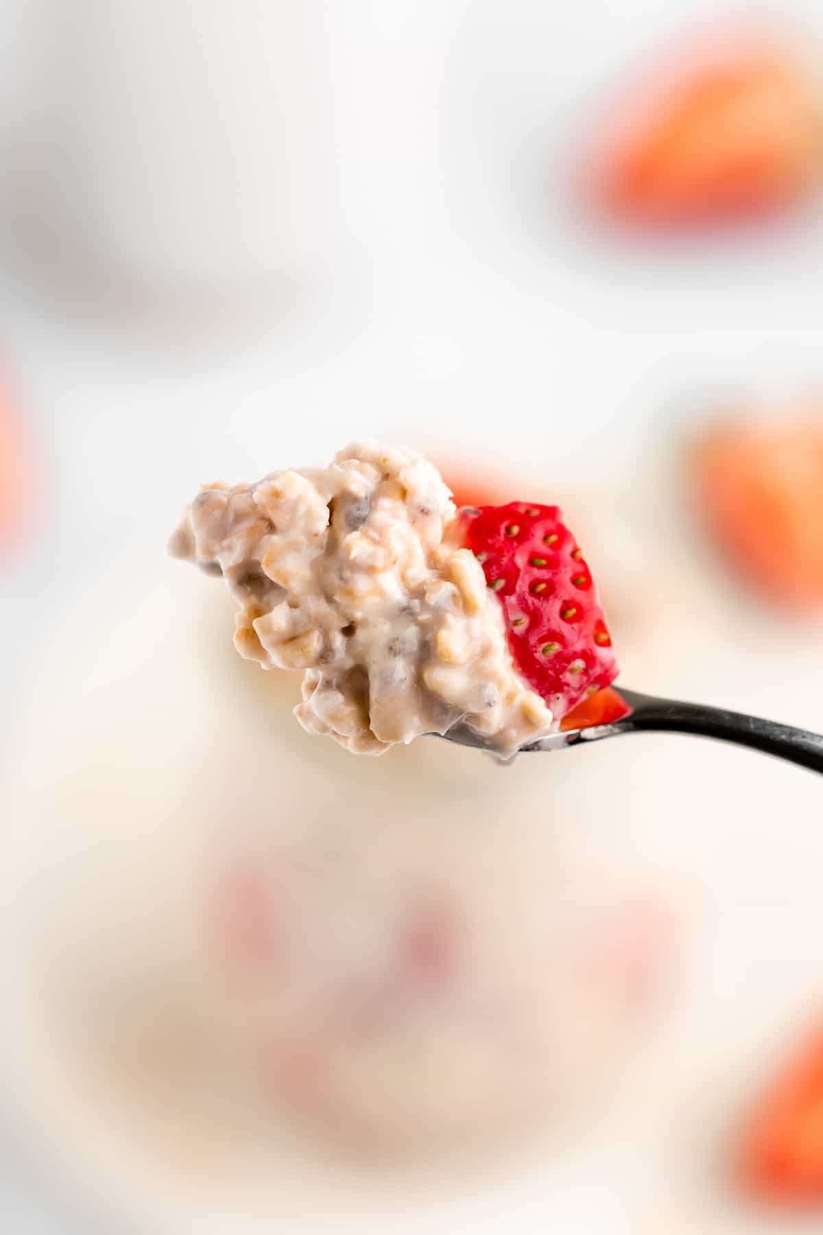 a spoonful of strawberries and cream overnight oats