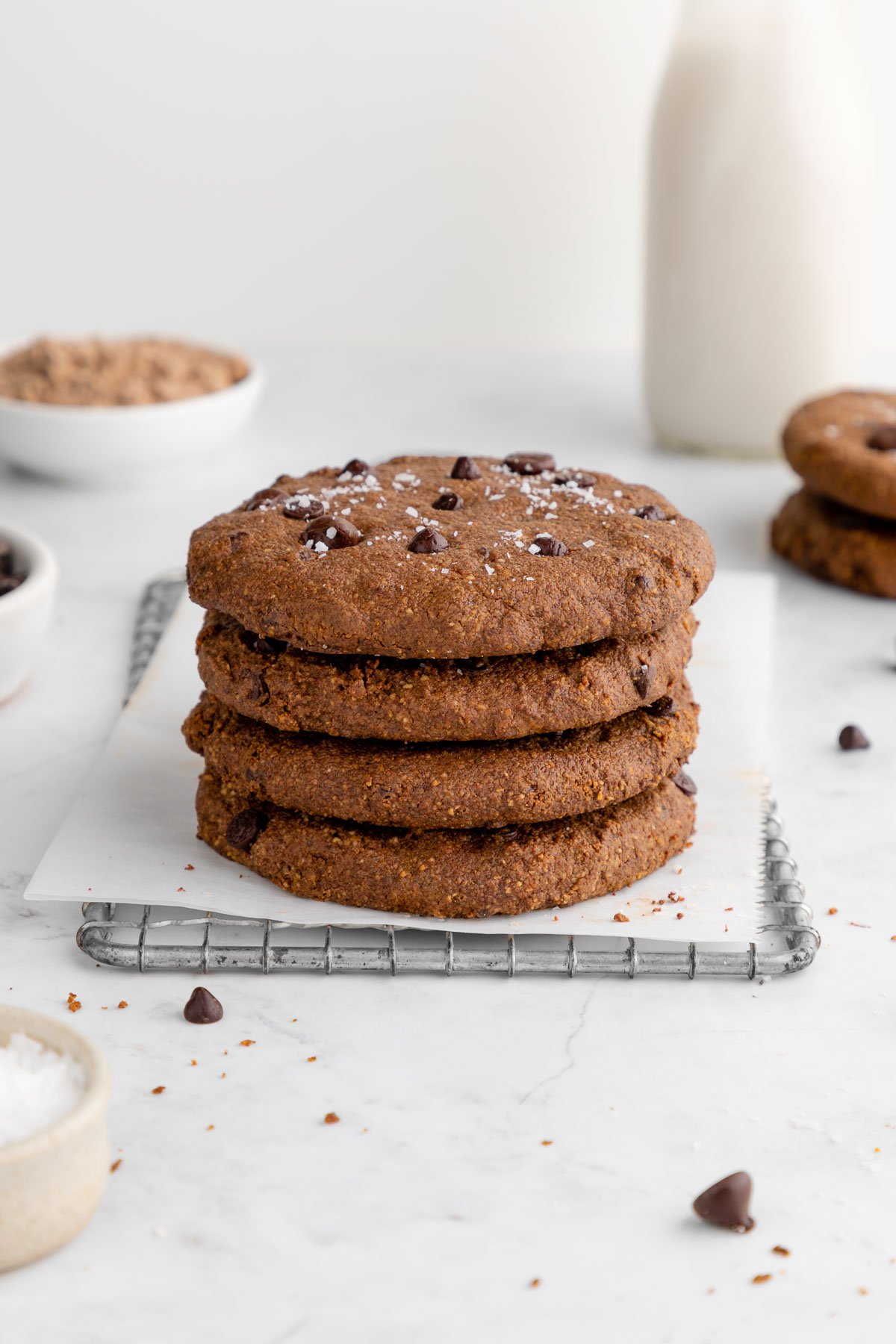 a stack of vegan chocolate protein cookies on a wire baking rack