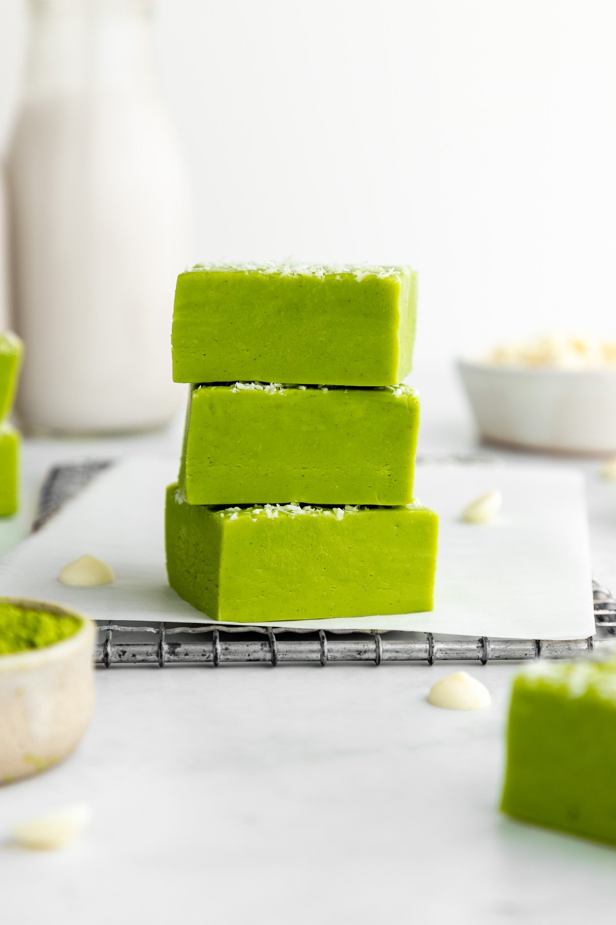 a stack of three white chocolate matcha fudge squares