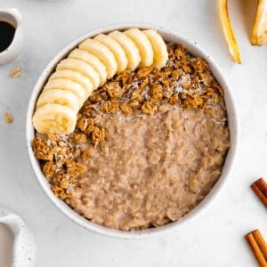 vegan banana oatmeal inside a speckled ceramic bowl