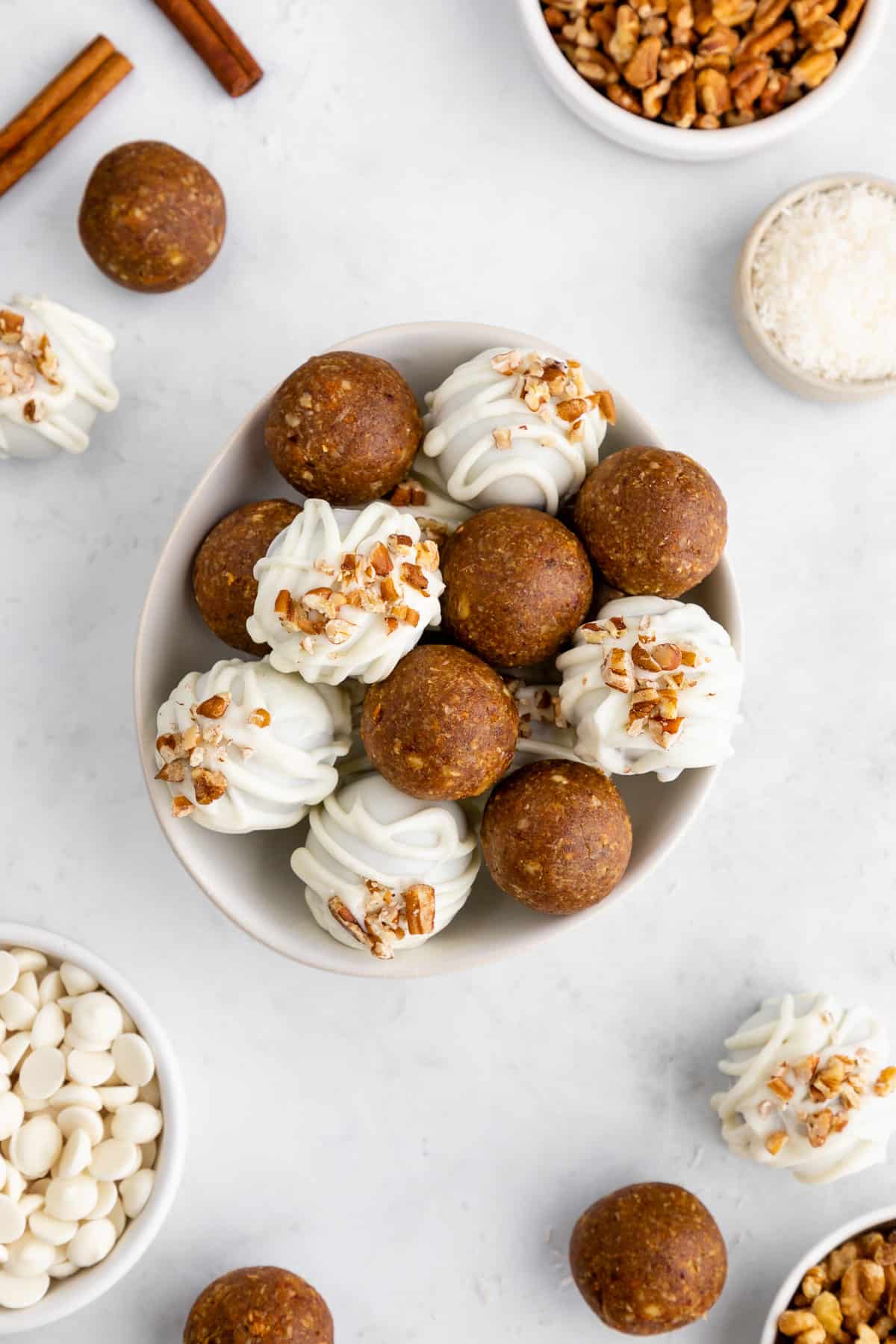a bowl of healthy no-bake carrot cake truffles with white chocolate