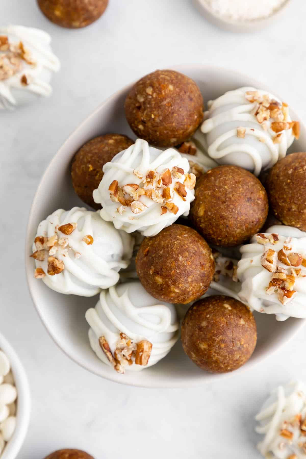 white chocolate carrot cake truffles in a bowl