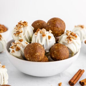 a bowl of no-bake carrot cake truffles with white chocolate