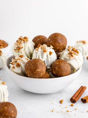a bowl of no-bake carrot cake truffles with white chocolate