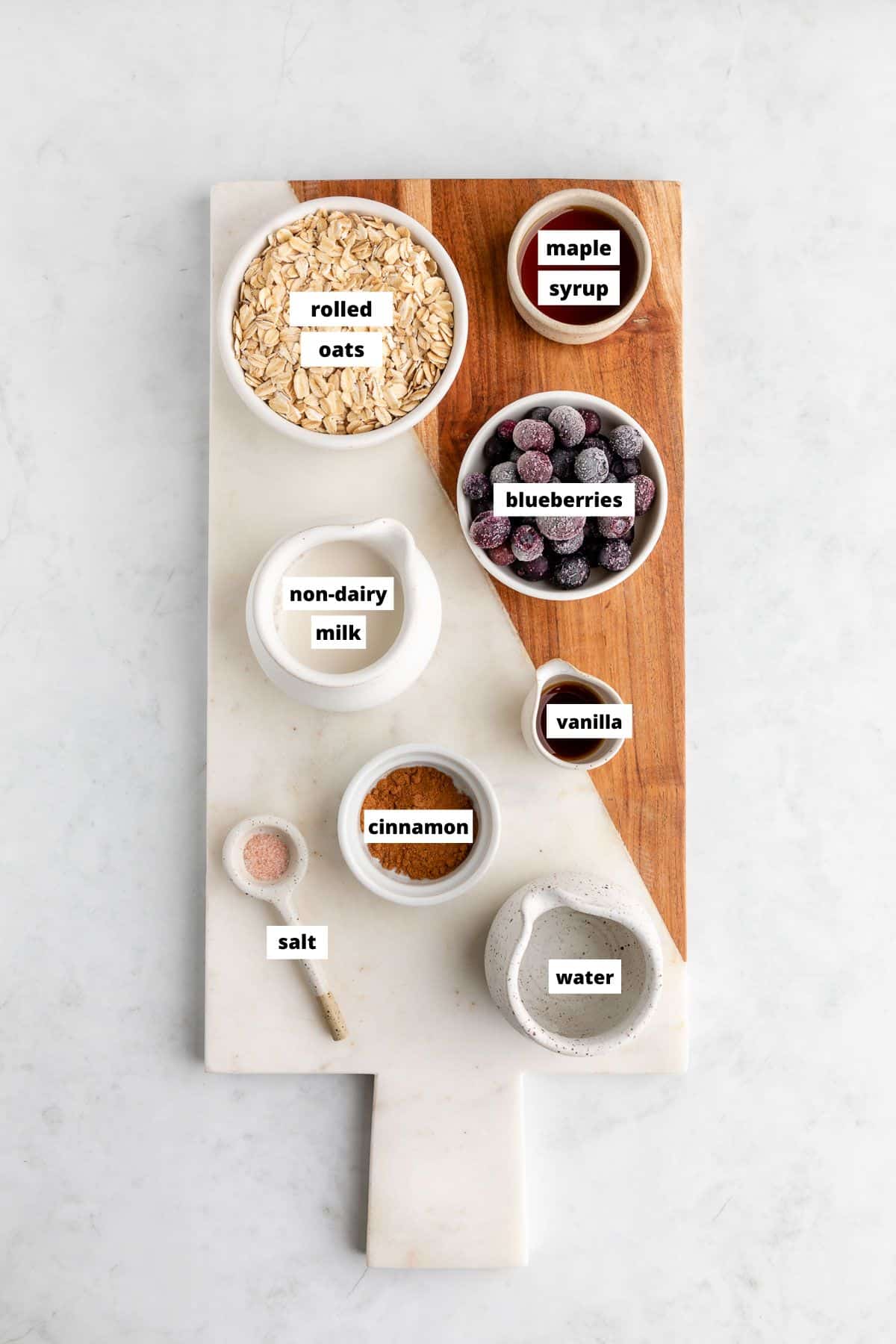 blueberry oatmeal ingredients on a marble serving board