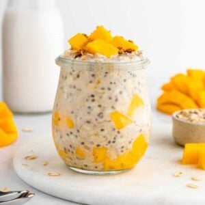 mango overnight oats with yogurt inside a glass weck jar