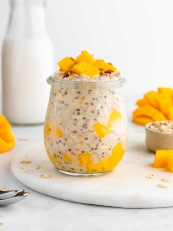 mango overnight oats with yogurt inside a glass weck jar