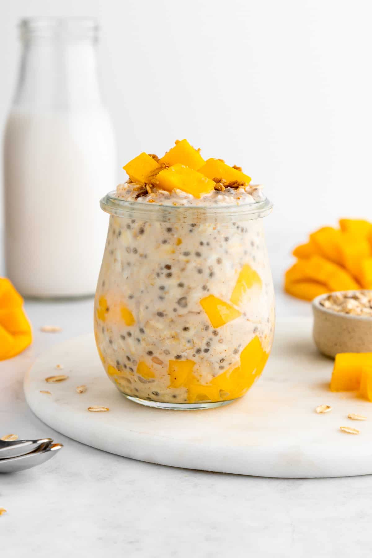 mango overnight oats with yogurt inside a glass weck jar
