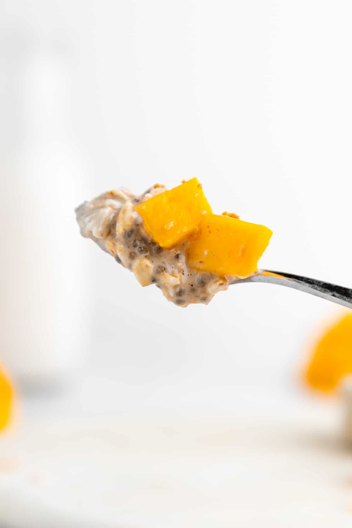 a spoonful of mango overnight oats