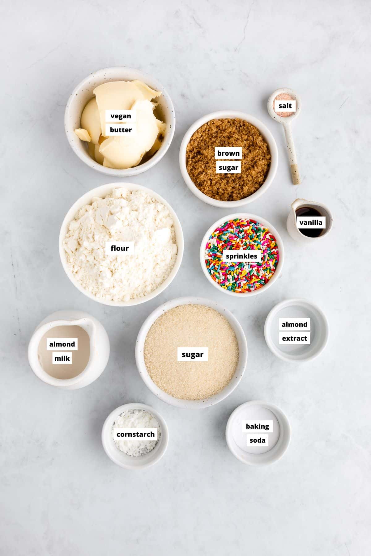 bowls of ingredients for vegan funfetti cookies