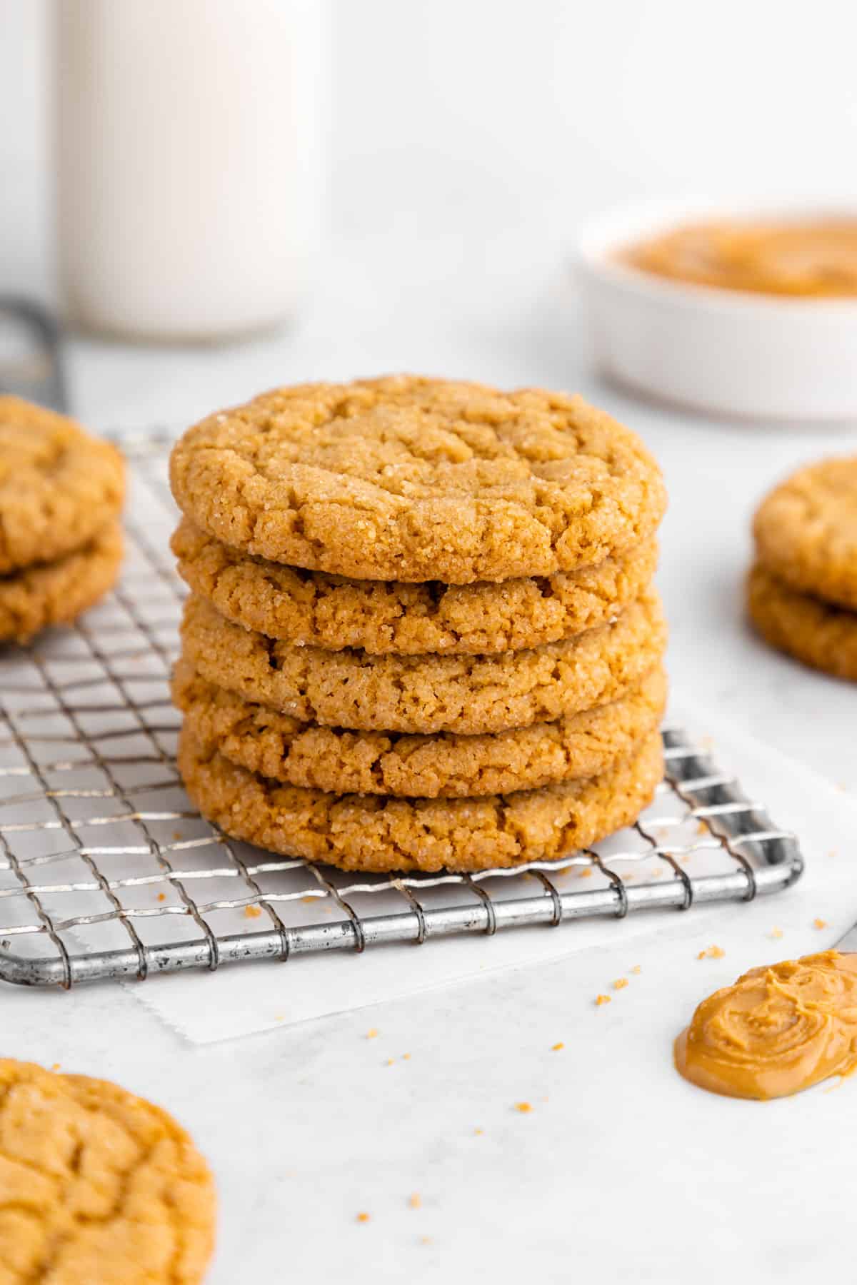 a stack of vegan peanut butter cookies on a wire rack