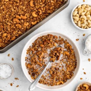 a baking sheet and a bowl of cashew butter granola