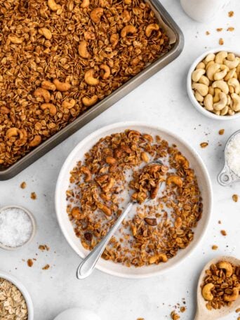 a baking sheet and a bowl of cashew butter granola