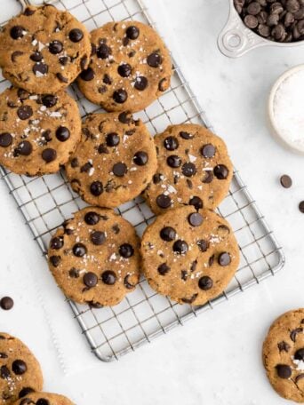 a pile of healthy chickpea chocolate chip cookies on a wire cooling rack