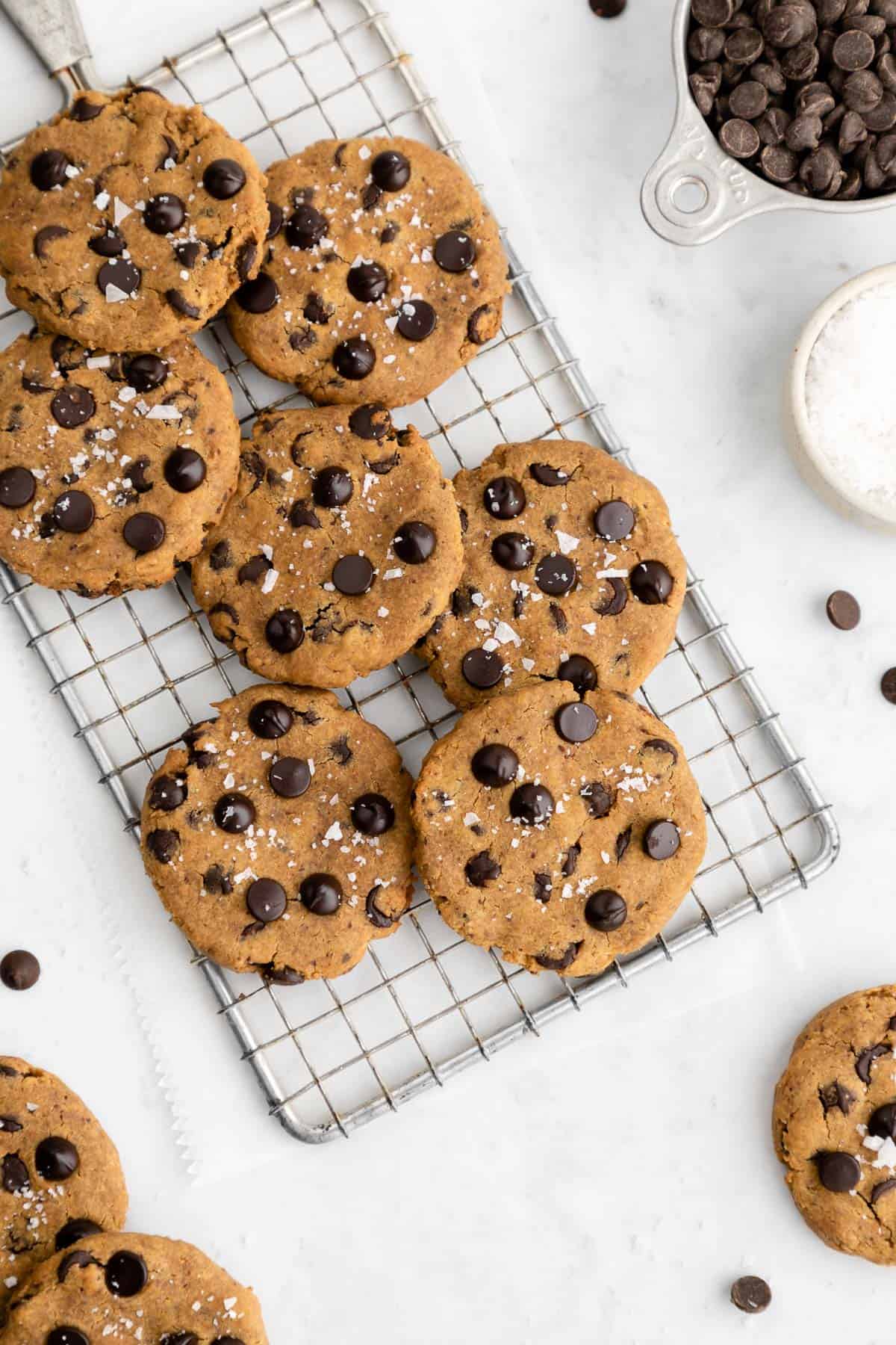 a pile of healthy chickpea chocolate chip cookies on a wire cooling rack