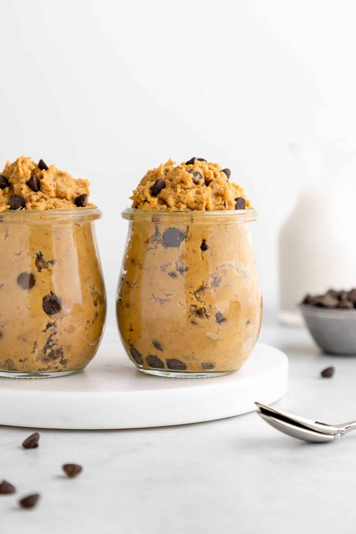 two glass jars filled with chickpea cookie dough