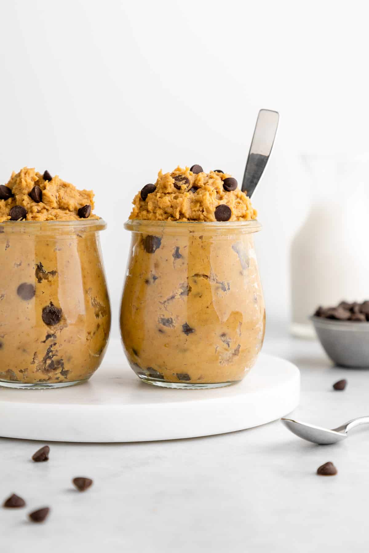 two glass jars filled with healthy chickpea cookie dough