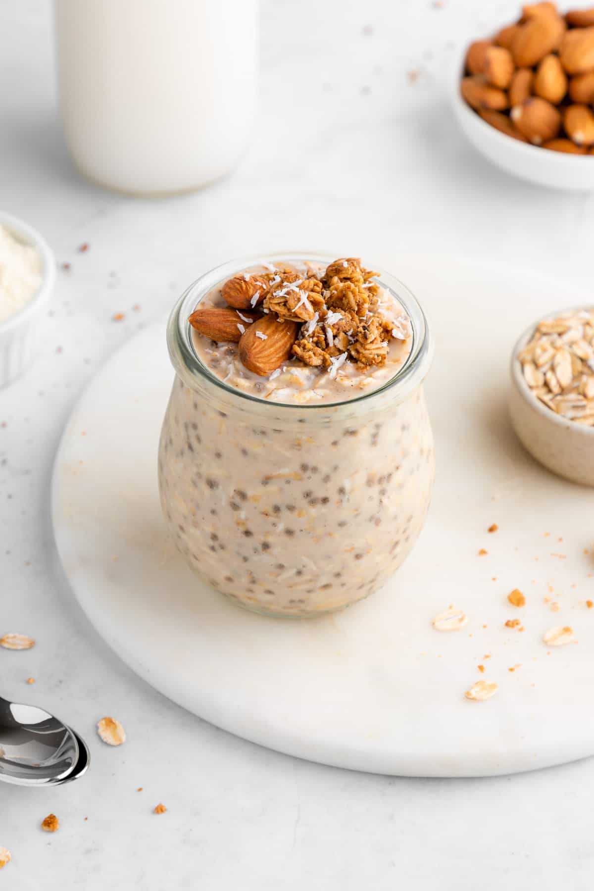 healthy protein overnight oats in a jar with chia seeds, protein powder, and yogurt