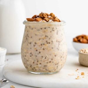protein overnight oats in a jar with chia seeds, yogurt, and protein powder