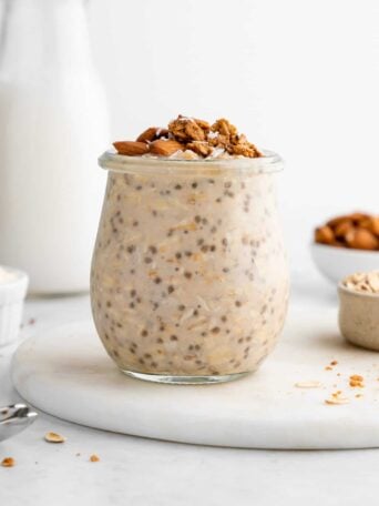 protein overnight oats in a jar with chia seeds, yogurt, and protein powder